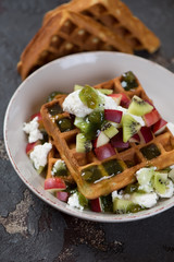 Breakfast with belgian waffles, sliced fresh fruits and ricotta cheese, close-up, vertical shot