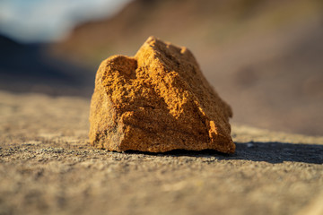 A sandstone with blurry background - seen on the ground of the former alum quarry in Kettleness Point, North Yorkshire, England, UK