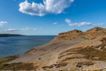 Clouds over the former alum quarry in Kettleness Point, North Yorkshire, England, UK