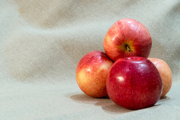 apples isolated on brown sackcloth