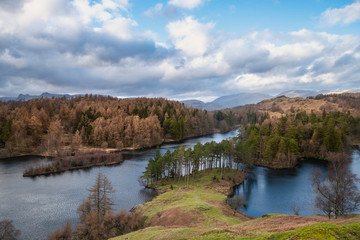 Stunning evening landscape image of Tarn Hows in UK Lake District during Spring