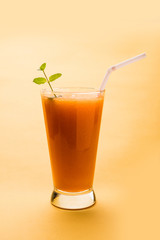Musk melon juice with slice, also known as Kharbuj/kharbuja fruit extract, served in a glass with mint. selective focus