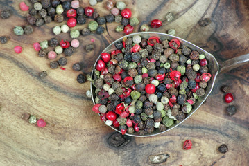 mixture of peppers in spoon. close up. 