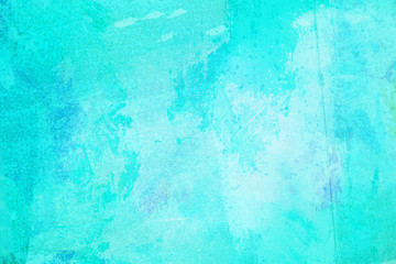 The abstract bright blue surface has a brush painted on the background for graphic design. 