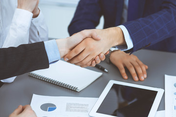 Obraz premium Business people shaking hands, finishing up a papers signing. Meeting, agreement and lawyer consulting concept