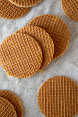 Homemade Dutch caramel waffles on cloth, overhead view. Top view, from above. Close-up.