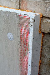 Insulating old flat house wall with white polystyrene - 260004009