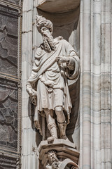 Obraz premium Decorative Religious figure at facade of the Cathedral of Milano, Milan, Italy