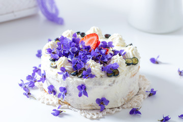 Delicious home-baked cream cake decorated with fresh violets (baked by Alina Tschemernjak) - 260005894