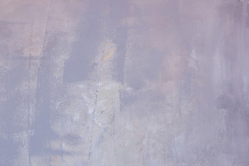 Concrete wall background with a blurry structure, concrete wall background dark lilac with splashes of white flowers