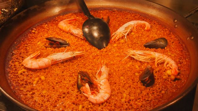 Madrid Spain Various delicacies and tasty food layout showcase in San Miguel market touristic city center. Seafood, bokadillo, empanadas and fish