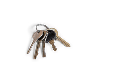 Several keys on a white isolated background, the keys to the apartment