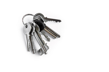 Several keys on a white isolated background,the keys to the apartment.