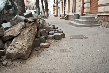 Paving the street in the city. Replacement of old paving tiles. Repairs. Chernivtsi, Ukraine, Europe, March 2019.