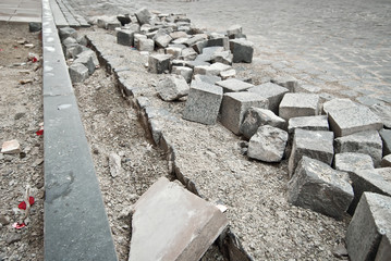 Paving the street in the city. Replacement of old paving tiles. Repairs. Chernivtsi, Ukraine, Europe, March 2019.