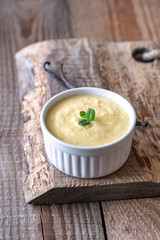 Custard on the wooden background