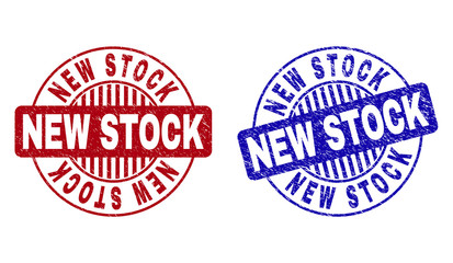 Grunge NEW STOCK round stamps isolated on a white background. Round seals with grunge texture in red and blue colors. Vector rubber watermark of NEW STOCK tag inside circle form with stripes.