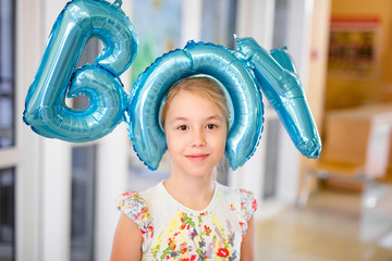 Young happy blonde girl with baloons smiling close up, lifestyle real people concept. Baloons...