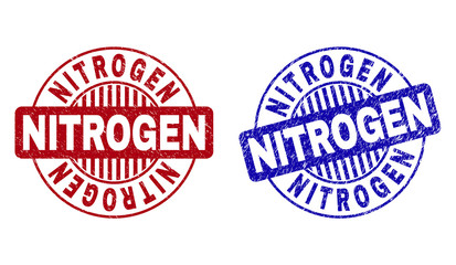 Grunge NITROGEN round stamp seals isolated on a white background. Round seals with grunge texture in red and blue colors. Vector rubber imprint of NITROGEN tag inside circle form with stripes.