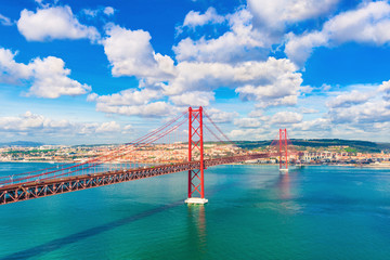 The 25th April Bridge (Ponte 25 de Abril) between Lisbon and Almada, Portugal. One of the longest...
