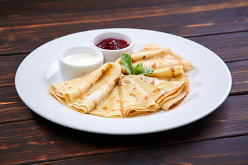 pancakes with sour cream and berry sauce