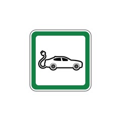 Green Road sign of car charging station