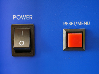 Power switch and reset button on blue background