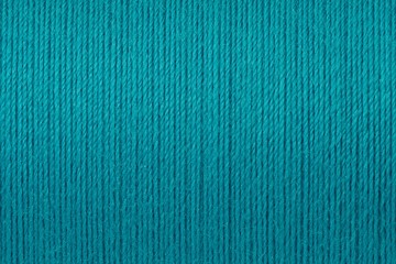 Macro picture of turquoise thread texture background