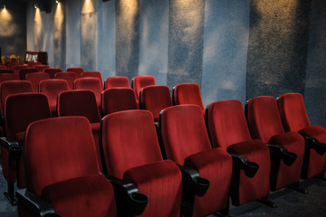 close up photo of rows of red seats in the cinema/theatre/concert hallcinema