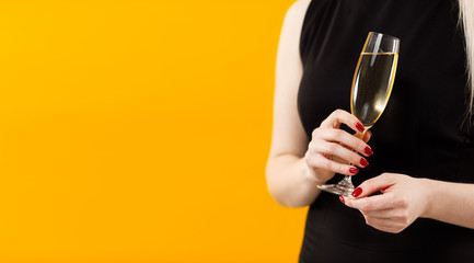 Beautiful sexy blonde girl holding in hands bottle of champange and wineglasses with champagne. Party girl. Celebrating.