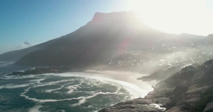 Tracking into a beautiful beach as the morning sun rises over the mountains in the background. Filmed 50FPS 4K 4096 x 2160 Delivered 25FPS 4096 x 2160 - Slowed down from the 50FPS Original.