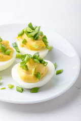 Creamy deviled eggs on festive Easter table