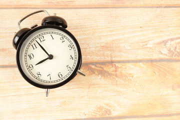 Time Punctuality Concept with black alarm clock.