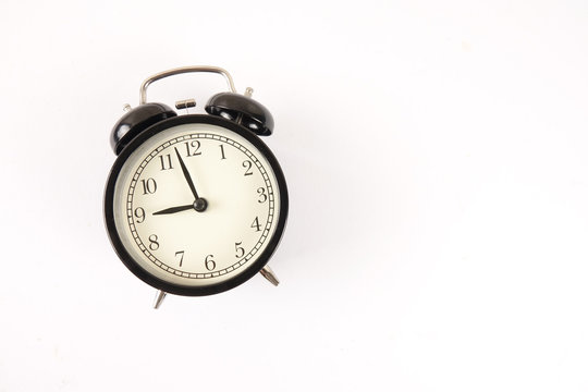 Time Punctuality Concept with black alarm clock.