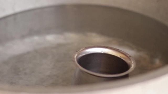 Steel Mug Floating in Water