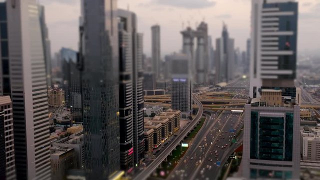 Miniature Dubai filmed by Tilt and Shift technique from one of the tall skyscrapers. The traffic moves in a time lapse mode.