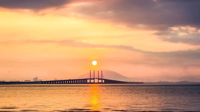 4K Time Lapse view of sunrise from Penang Bridge of George Town