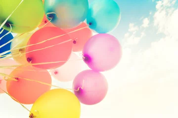 Fototapeten Colorful balloons done with a retro instagram filter effect. Concept of happy birth day in summer and wedding, honeymoon party use for background. Vintage color tone style © jakkapan