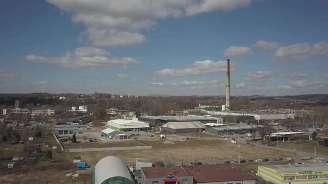Gorlice, Poland - 3 9 2019: Industrial region of the Carpathian city. Top view of the refinery and auxiliary buildings. Video shot by drone or quadrocopter. Vanity of the day at the factory. Planning 