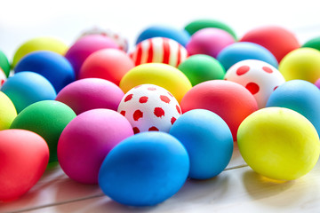 Colorful Easter eggs on wooden background
