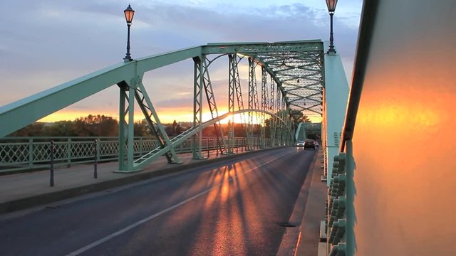 Early morning; cars are driving on M&aacute;ria Val&eacute;ria Bridge in Esztergom, Hungary.