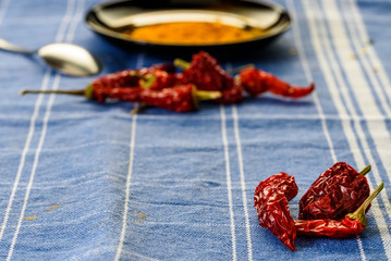 red pepper on the table, still life with red pepper over a blue tablecloth. cooking spicy food....