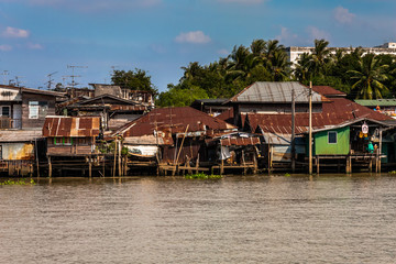 Poor dwellings on the Chao Phraya River near Bangkok, Thailand
