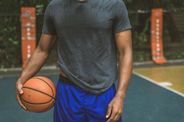 Basketball player training outdoors