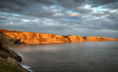 Evening at the cliff face of the magnificent coastline of the Welsh Heritage Coast in South Wales, UK