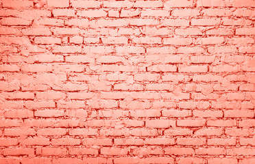 Coral pink toned brick wall background texture