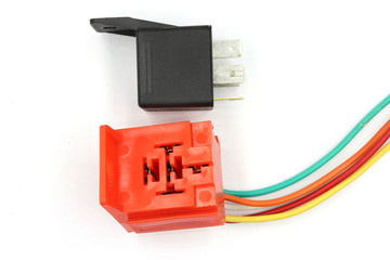 Coil Power Relay, magnetic contactor, 12v auto part with socket isolated on white background.