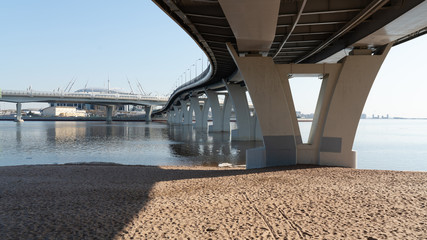 modern pedestrian bridge across the Bay in St. Petersburg. concrete bridge supports .Russia