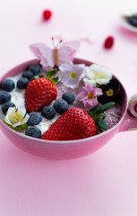 Chiapudding in different colors with fresh fruits and flowers
