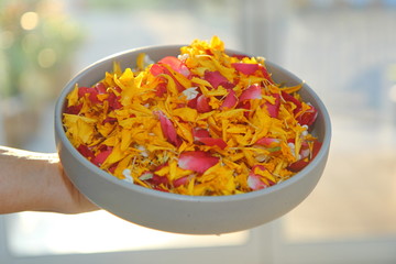 Petal many different kinds of colors are good on white plate for use on the water  to the Songkran Festival.